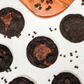 Dark chocolate cookies with molten Nutella centres finished with flaky sea salt, scattered with chocolate chips.
