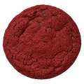 A Red Velvet cookie seen from above, deep red and cracked across the top.